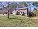 Charming two-story brick home with mature landscaping and a welcoming entrance at 6507 Bennington Dr, Tucker, GA 30084