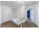 Second floor hallway featuring neutral colored carpet and access to multiple rooms at 6507 Bennington Dr, Tucker, GA 30084