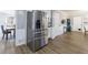 Kitchen view showing a large stainless steel refrigerator and a view into the adjacent dining room at 6507 Bennington Dr, Tucker, GA 30084