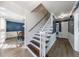 Entryway with staircase leading to the second floor, beautiful wall trim, and view to the dining room at 6507 Bennington Dr, Tucker, GA 30084