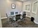 Conference room with a glass table, modern chairs, natural light, and carpet flooring at 800 Peachtree Ne St # 8415, Atlanta, GA 30308