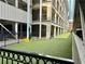 Community dog park area with artificial turf and secure fencing, providing a pet-friendly space at 800 Peachtree Ne St # 8415, Atlanta, GA 30308