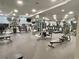 Community gym featuring various exercise machines, free weights, and mirrors at 800 Peachtree Ne St # 8415, Atlanta, GA 30308