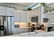 Modern white kitchen with subway tile backsplash, stainless steel appliances, and bright lighting at 800 Peachtree Ne St # 8415, Atlanta, GA 30308