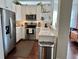 Modern kitchen with stainless steel appliances and white cabinets at 800 Peachtree Ne St # 8415, Atlanta, GA 30308