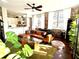 Cozy living room with exposed brick and modern decor, open to the kitchen at 800 Peachtree Ne St # 8415, Atlanta, GA 30308