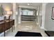 Elegant lobby features neutral colors, glossy tile floors and a decorative console table at 800 Peachtree Ne St # 8415, Atlanta, GA 30308