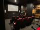 Community movie theatre room with comfortable seating and a large screen for entertainment at 800 Peachtree Ne St # 8415, Atlanta, GA 30308