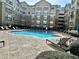 Outdoor pool with lounge chairs and seating areas in a community setting at 800 Peachtree Ne St # 8415, Atlanta, GA 30308