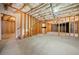 Unfinished basement with exposed wood beams and concrete flooring providing a blank canvas at 1151 Nash Lee Sw Dr, Lilburn, GA 30047