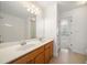 Bathroom features a double sink vanity and a large mirror with a shower/tub combo at 1151 Nash Lee Sw Dr, Lilburn, GA 30047