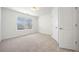 Bedroom with carpeted flooring, a window with blinds, and a double-door closet at 1151 Nash Lee Sw Dr, Lilburn, GA 30047