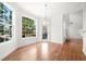 Bright breakfast nook with large windows and hardwood floors at 1151 Nash Lee Sw Dr, Lilburn, GA 30047