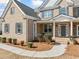 Close up of home exterior showcasing the front entrance and detailed landscaping at 1151 Nash Lee Sw Dr, Lilburn, GA 30047
