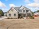 Beautiful two-story brick home featuring well-manicured landscaping and a welcoming front entrance at 1151 Nash Lee Sw Dr, Lilburn, GA 30047
