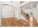 Spacious foyer showcasing hardwood floors, staircase and formal dining room at 1151 Nash Lee Sw Dr, Lilburn, GA 30047