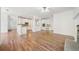 Open floor plan with hardwood floors connecting the living room to the kitchen at 1151 Nash Lee Sw Dr, Lilburn, GA 30047