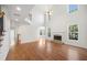 Bright living room with hardwood floors, a fireplace, and large windows for natural light at 1151 Nash Lee Sw Dr, Lilburn, GA 30047