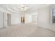 Main bedroom with a ceiling fan, neutral carpet, recessed lights, and many windows at 1151 Nash Lee Sw Dr, Lilburn, GA 30047
