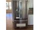 Stainless steel refrigerator with filtered water dispenser in a bright kitchen setting at 1151 Nash Lee Sw Dr, Lilburn, GA 30047