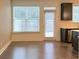 Dining area and kitchen with large window and access to the fenced backyard at 263 Auburn Valley Way, Auburn, GA 30011