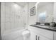 Bathroom features modern tile surround and updated sink at 395 W Lake Nw Ave, Atlanta, GA 30318