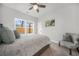 Comfortable bedroom featuring a ceiling fan, natural light from a window, and neutral wall colors at 395 W Lake Nw Ave, Atlanta, GA 30318