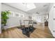 Open dining area with wood floors, modern table, and views of the home's interior at 395 W Lake Nw Ave, Atlanta, GA 30318