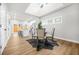 Bright dining area with a skylight and hardwood floors with adjacent kitchen at 395 W Lake Nw Ave, Atlanta, GA 30318