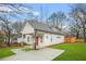 Well-maintained home featuring a cozy front porch and manicured lawn at 395 W Lake Nw Ave, Atlanta, GA 30318