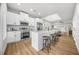 Modern kitchen with stainless steel appliances, white cabinets, and granite countertops at 395 W Lake Nw Ave, Atlanta, GA 30318