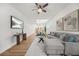 Bright and airy living room featuring modern decor, hardwood floors, and a comfortable gray couch at 395 W Lake Nw Ave, Atlanta, GA 30318