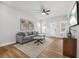 Modern living room featuring hardwood floors, neutral decor, and comfortable seating at 395 W Lake Nw Ave, Atlanta, GA 30318