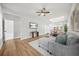Open-concept living room featuring hardwood floors, skylight, and comfortable seating at 395 W Lake Nw Ave, Atlanta, GA 30318