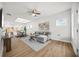 Bright, open living room with hardwood floors, modern furniture, and plenty of natural light at 395 W Lake Nw Ave, Atlanta, GA 30318