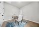 Office space with light walls, a modern desk and chair, and a blue rug atop neutral carpet at 395 W Lake Nw Ave, Atlanta, GA 30318