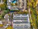 Aerial view of a residential complex featuring a pool, parking, and lush greenery in a vibrant community at 400 Village Ne Pkwy # 120, Atlanta, GA 30306