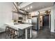 Modern kitchen with stainless steel appliances, a spacious island, and stylish pendant lighting at 400 Village Ne Pkwy # 120, Atlanta, GA 30306