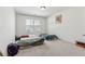 Bedroom featuring carpet floors, white walls, a window, and room for two beds, offering a blank canvas at 5955 Princeton Run Trl, Tucker, GA 30084