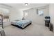 Simple bedroom with white walls, carpeted floors, and natural light from two windows, providing a blank canvas at 5955 Princeton Run Trl, Tucker, GA 30084