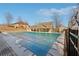 Community pool covered with a safety cover surrounded by patio space and community buildings at 5955 Princeton Run Trl, Tucker, GA 30084