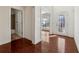 Bright entryway with gleaming hardwood floors, white trim, and a decorative glass front door at 5955 Princeton Run Trl, Tucker, GA 30084
