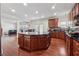 Kitchen with granite countertops, a dark wood island, and stainless steel appliances at 5955 Princeton Run Trl, Tucker, GA 30084