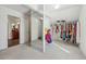 Walk-in closet with ample storage solutions, and an adjoining bathroom at 5955 Princeton Run Trl, Tucker, GA 30084