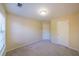 Bedroom featuring a window, closet, and neutral color scheme at 699 Coligny Ct, Atlanta, GA 30350