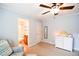 Well-lit bedroom leads to the en-suite bathroom at 160 Edgewater Trl, Fayetteville, GA 30215