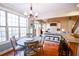 Bright breakfast nook with large windows, hardwood floors, and stylish chandelier at 160 Edgewater Trl, Fayetteville, GA 30215