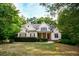 Charming home with a manicured front yard and mature trees offering great curb appeal at 160 Edgewater Trl, Fayetteville, GA 30215