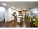 Open kitchen with stainless steel appliances and an island, adjacent to a dining area and bedroom at 160 Edgewater Trl, Fayetteville, GA 30215