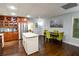 Kitchen features a kitchen island, stainless steel appliances, granite countertops, and wooden floors at 160 Edgewater Trl, Fayetteville, GA 30215